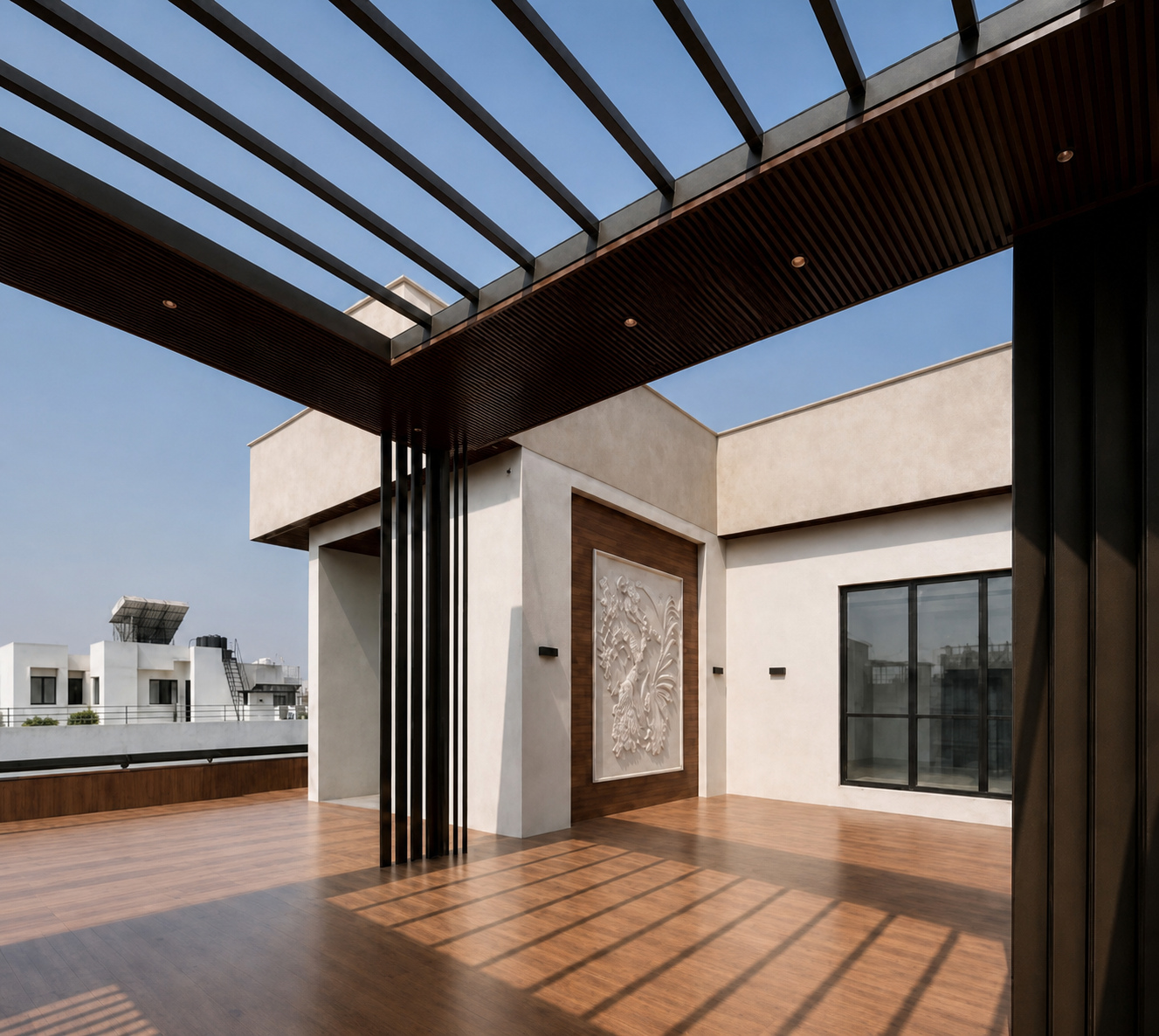 The rooftop deck at sunrise, striped with shadow from the steel and walnut pergola